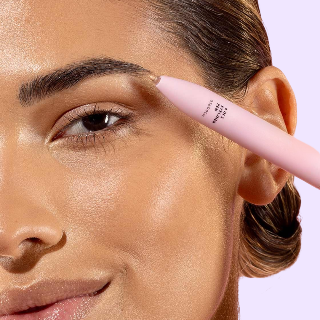 zoomed in portrait of a women using 4 in 1 makeup pen on eyebrows